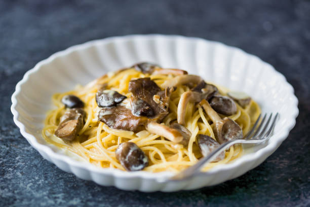 istock rustic italian spaghetti pasta in mushroom cream sauce 1285961294