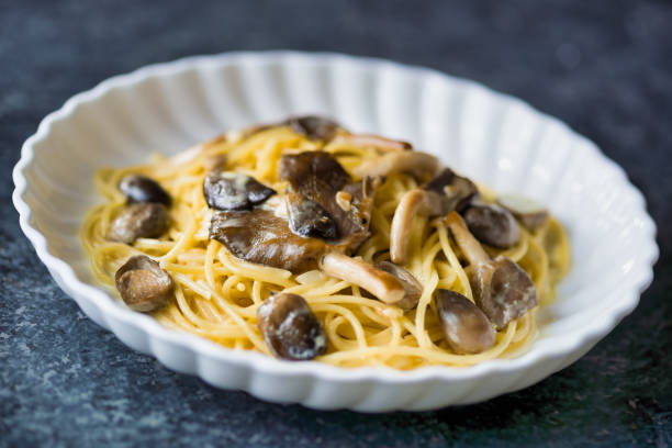 istock rustic italian spaghetti pasta in mushroom cream sauce 1285961335