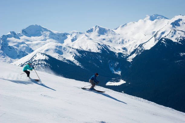 istock Couple skiing in the mountains 1285961393