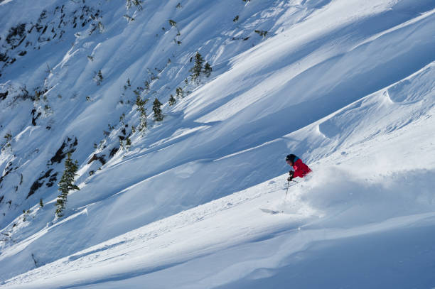 istock Woman skiing fresh powder on a ski vacation 1285962254