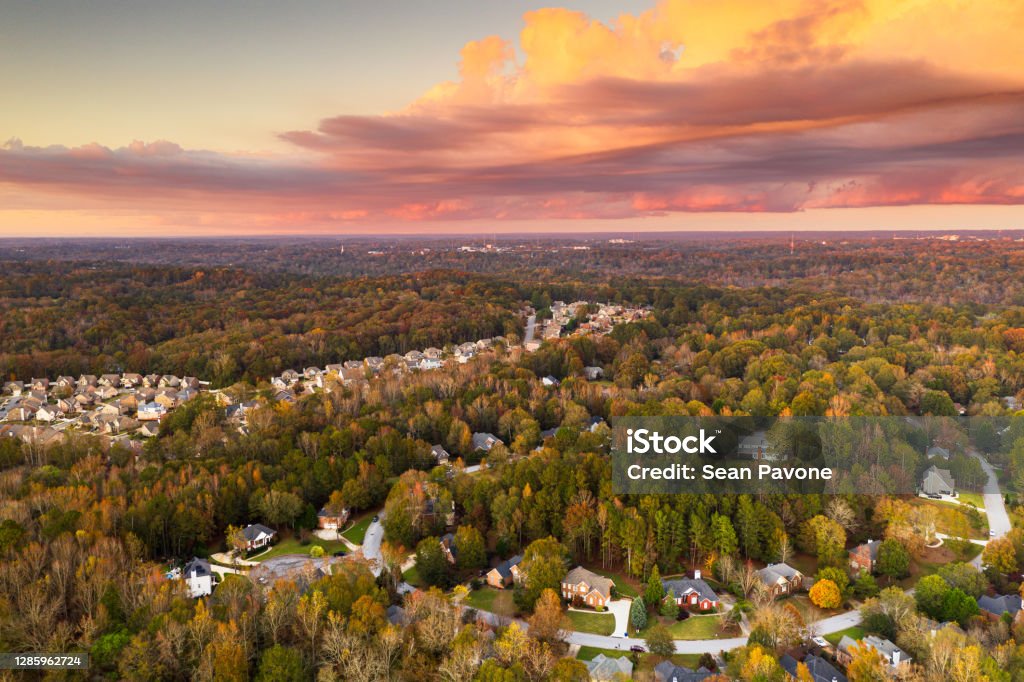 Neighborhoods in Autumn at Dusk Suburban neighborhoods viewed from above during an autumn dusk. Georgia - US State Stock Photo