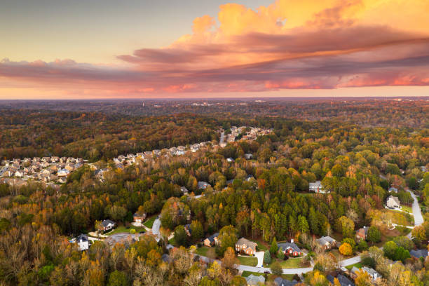 Neighborhoods in Autumn at Dusk Suburban neighborhoods viewed from above during an autumn dusk. georgia country stock pictures, royalty-free photos & images