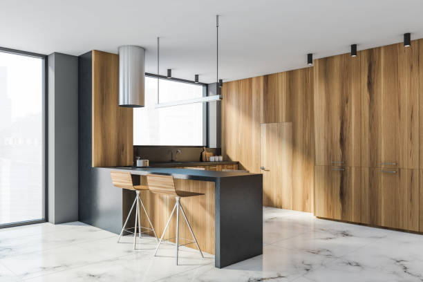 istock Modern gray and wooden kitchen corner with bar 1285963682