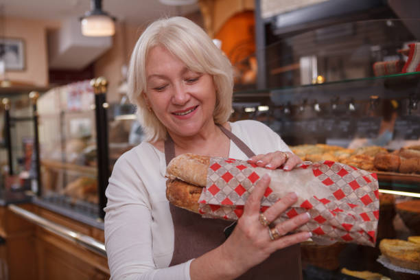istock Mature woman working at her bakery 1285963762