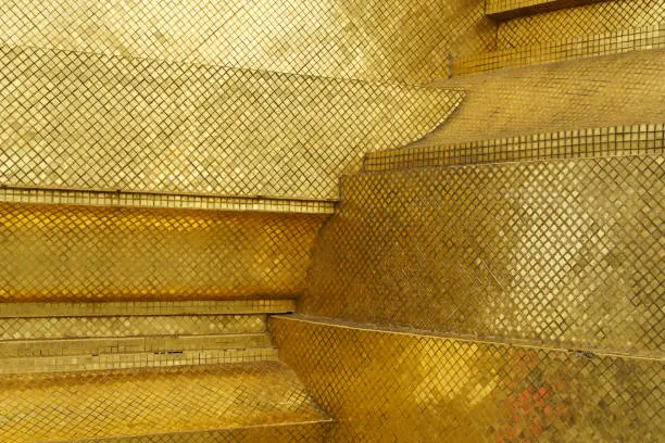 Photo of Gold tiles reflection background