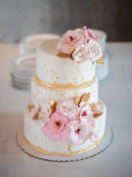 istock Beautiful large wedding cake with flowers. Sweets 1285964535