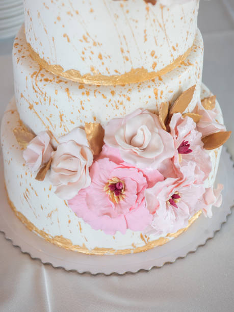istock Beautiful large wedding cake with flowers. Sweets 1285964537