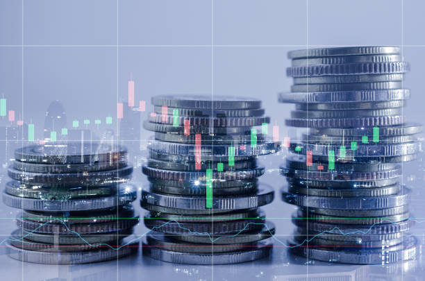 istock double exposure of city with row of coin stack with growth stock chart and graph progress report for business investment finance banking and money saving concept. 1285965796