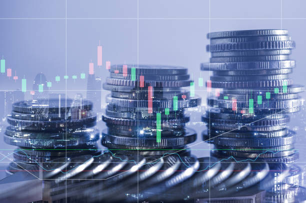 istock double exposure of city with row of coin stack with growth stock chart and graph progress report for business investment finance banking and money saving concept. 1285965797
