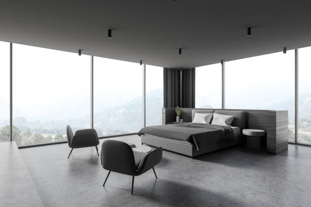 istock Panoramic wooden and gray master bedroom corner with armchairs 1285965880