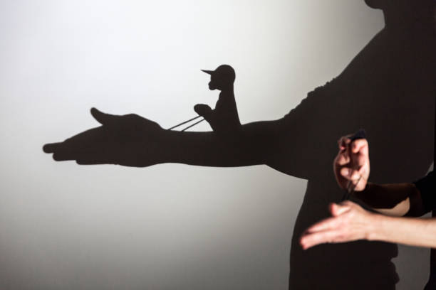 istock play shadow projected against a white background. horse, rider. 1285966485