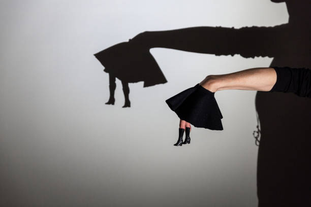 istock play shadow projected against a white background, legs of a dancer 1285966608