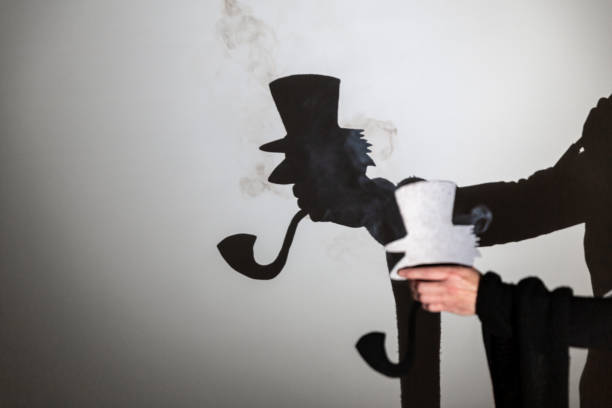 play shadow projected against a white background. a old man with hat.