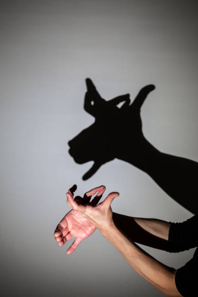 istock play shadow projected against a white background, rudolph reindeer 1285967399
