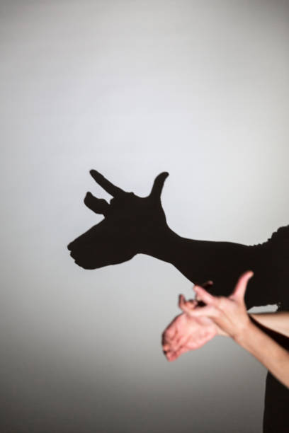 istock play shadow projected against a white background, rudolph reindeer 1285967406