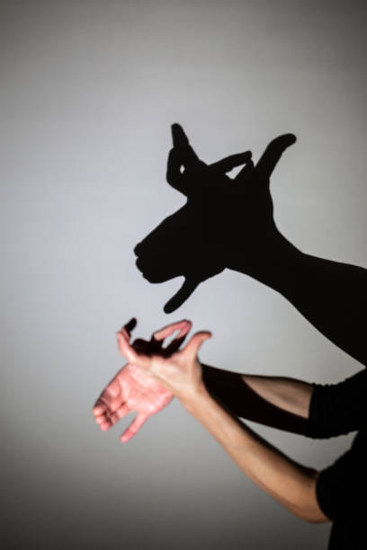 istock play shadow projected against a white background, rudolph reindeer 1285967411