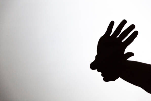 istock play shadow projected against a white background, american indian 1285967495