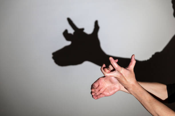 istock play shadow projected against a white background, rudolph reindeer 1285967516