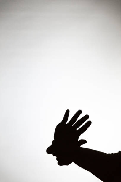 istock play shadow projected against a white background, american indian 1285967554