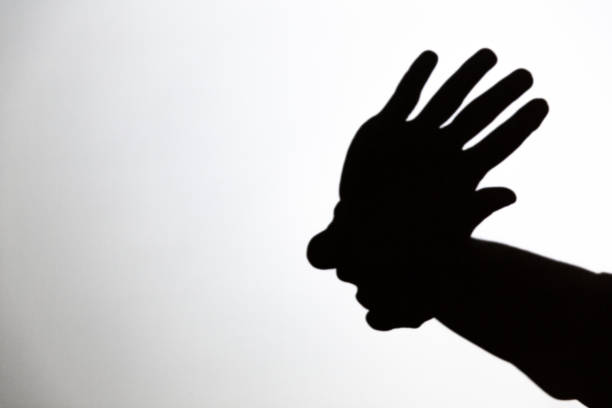 istock play shadow projected against a white background, american indian 1285967600