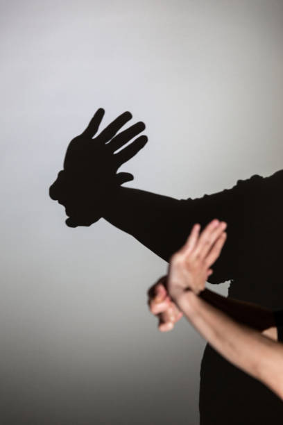 istock play shadow projected against a white background, american indian 1285967619