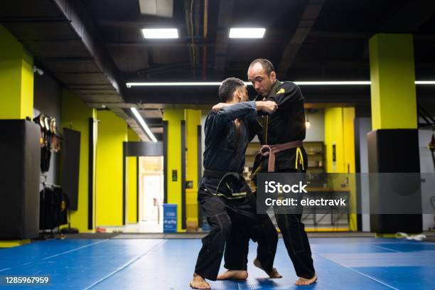 Martial Arts Athletes Training Stock Photo - Download Image Now - Jujitsu, Gi - Martial Arts Clothing, 20-24 Years