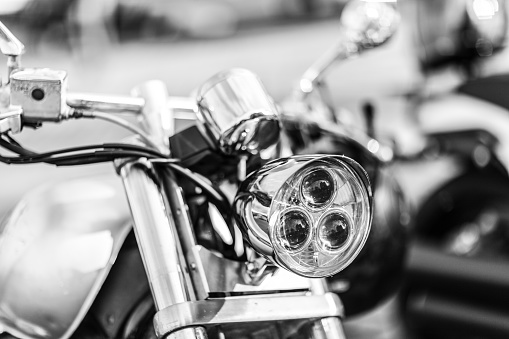 Hamburg, Germany- November 15.2020: Black and white image of the modern lighting technology on a parked motorcycle, somewhere in Hamburg