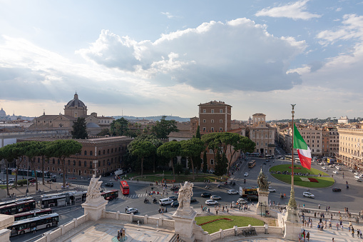 Rome, Italy - June 19, 2018: Panoramic view of Piazza Venezia and city from Vittorio Emanuele II Monument also known as the Vittoriano in Rome. Traffic cars and summer day with blue sky