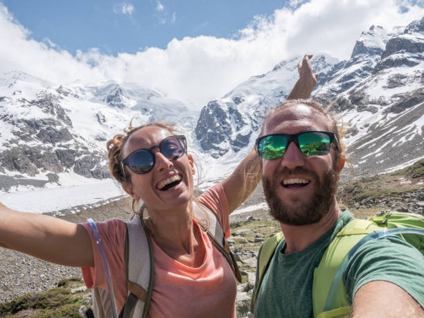 istock Hiking couple take selfie in mountains 1285968269