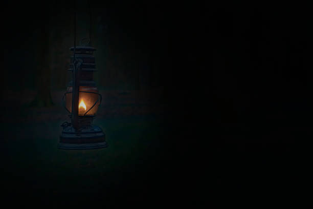 Vintage lamp with a candle and lights at night