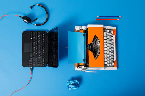 istock Digital and analog – Laptop and 70s Typewriter 1285970087