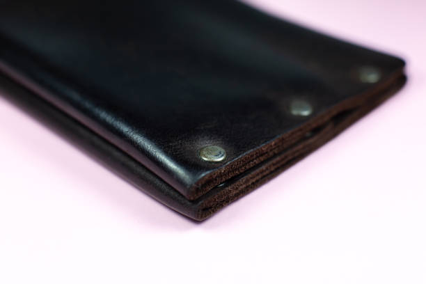 istock Brown mens leather wallet on pink background. 1285971970