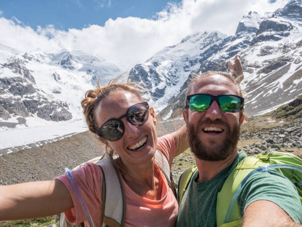 istock Hiking couple take selfie in mountains 1285973114