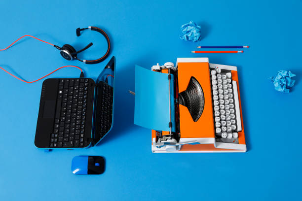 istock Digital and analog – Laptop and 70s Typewriter 1285973145