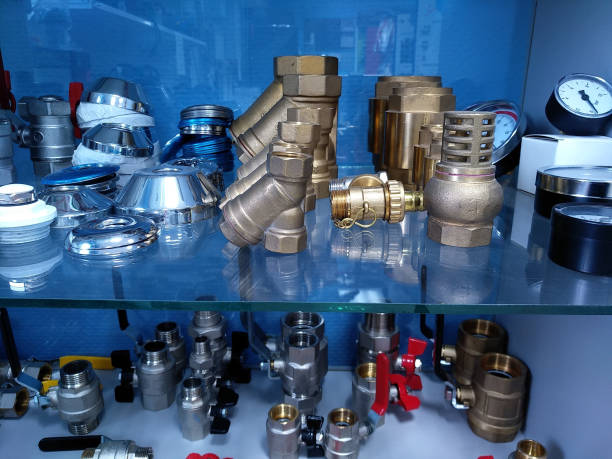 istock Water pipe brass fittings on glass shelf 1285973700