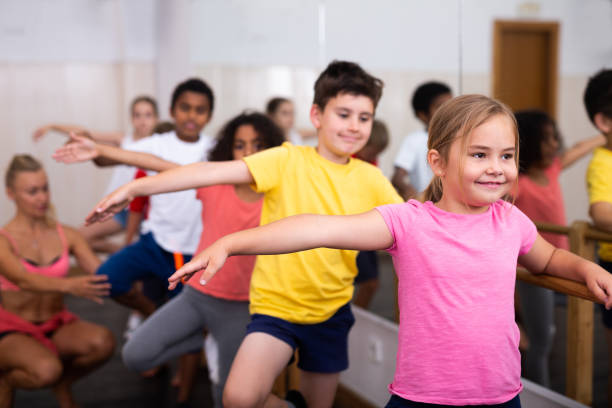 istock Boys and girls training along ballet bar 1285974103