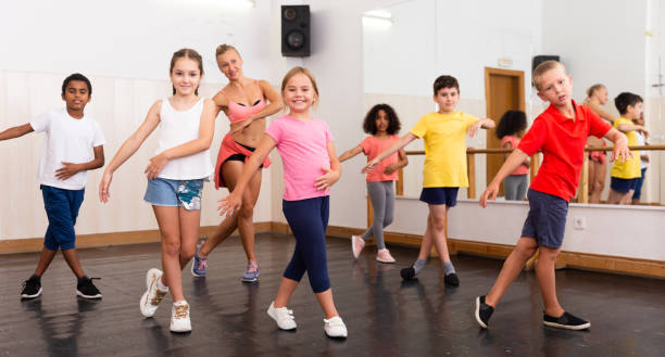 istock Children with teacher participating in dance class 1285974148