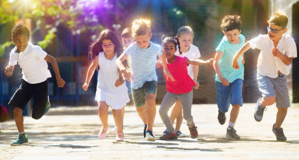 istock Activity children compete in the city street 1285974836