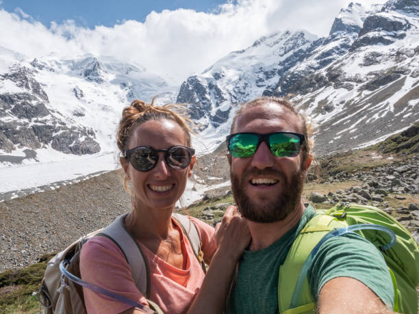 istock Hiking couple take selfie in mountains 1285976664