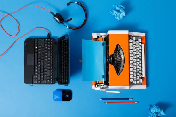 istock Digital and analog – Laptop and 70s Typewriter 1285977079
