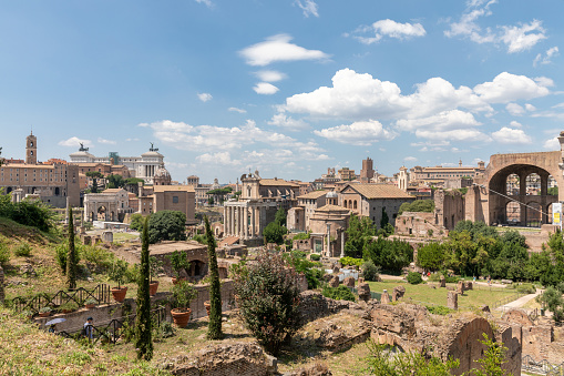 Panoramic view of Roman forum, also known by Forum Romanum or Foro Romano from Palatine Hill. It is a forum surrounded by ruins of ancient government buildings at center of city of Rome