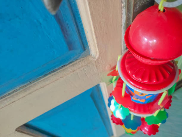 istock Plastic baby toy hanging on the door handle 1285978095