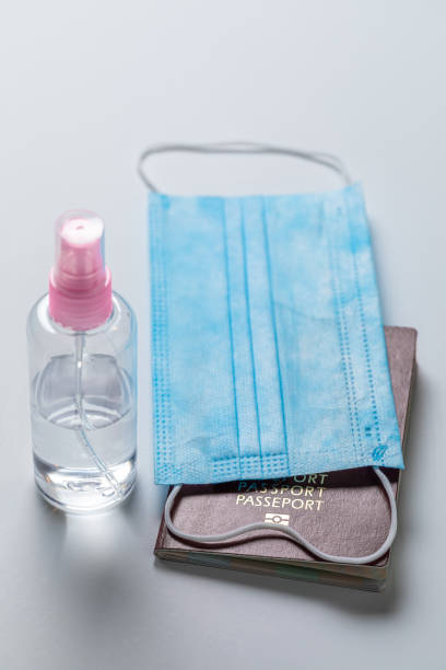 istock Protective mask and passport as restrictions in coronavirus pandemic 1285978754