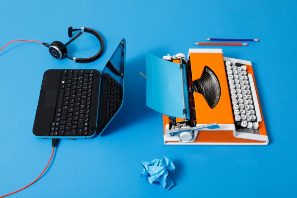 istock Digital and analog – Laptop and 70s Typewriter 1285979761