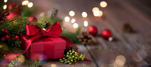 istock Christmas Gift on Old Wood Background 1285980927