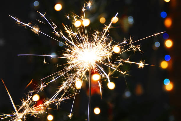 istock Lights. Sparks. Christmas background. Christmas lights close up. Celebration 1285980964
