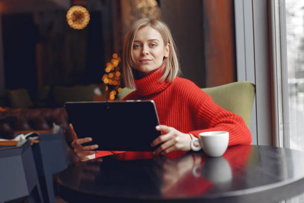 istock Businesswoman in a red sweater works 1285981062
