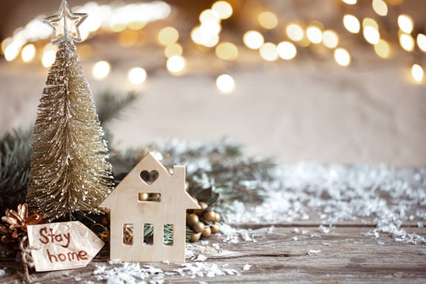 istock Christmas cozy background with decor details, snow and blurry lights copy space. 1285981292
