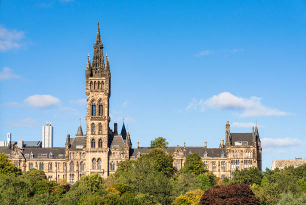 Glasgow United Front view looking over part of Kelvingrove Park to the imposing architecture of Glasgow University's main building, in the city's West End. glasgow scotland stock pictures, royalty-free photos & images