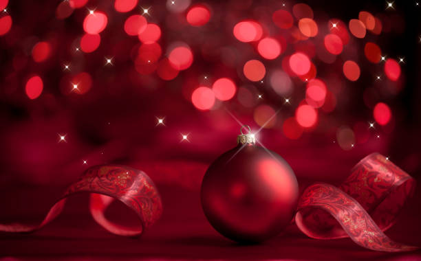 istock Christmas Red Bauble on a Red and Black Background 1285981704